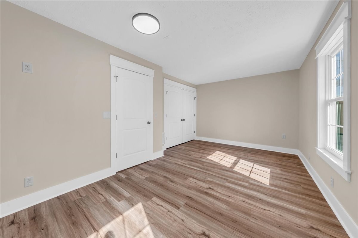 145 Hawkins Road Smithville, TN 37166 - Photo 24 of 45 a view of empty room with wooden floor and fan