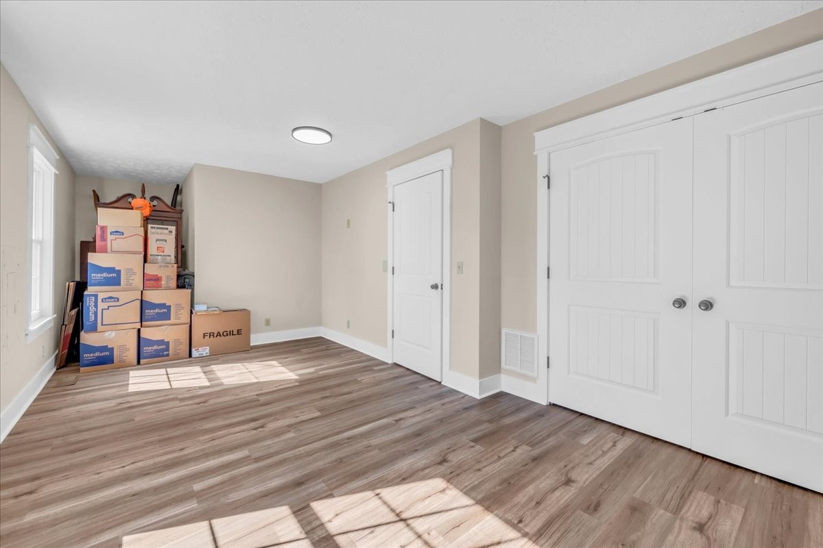 145 Hawkins Road Smithville, TN 37166 - Photo 25 of 45 a view of empty room with wooden floor