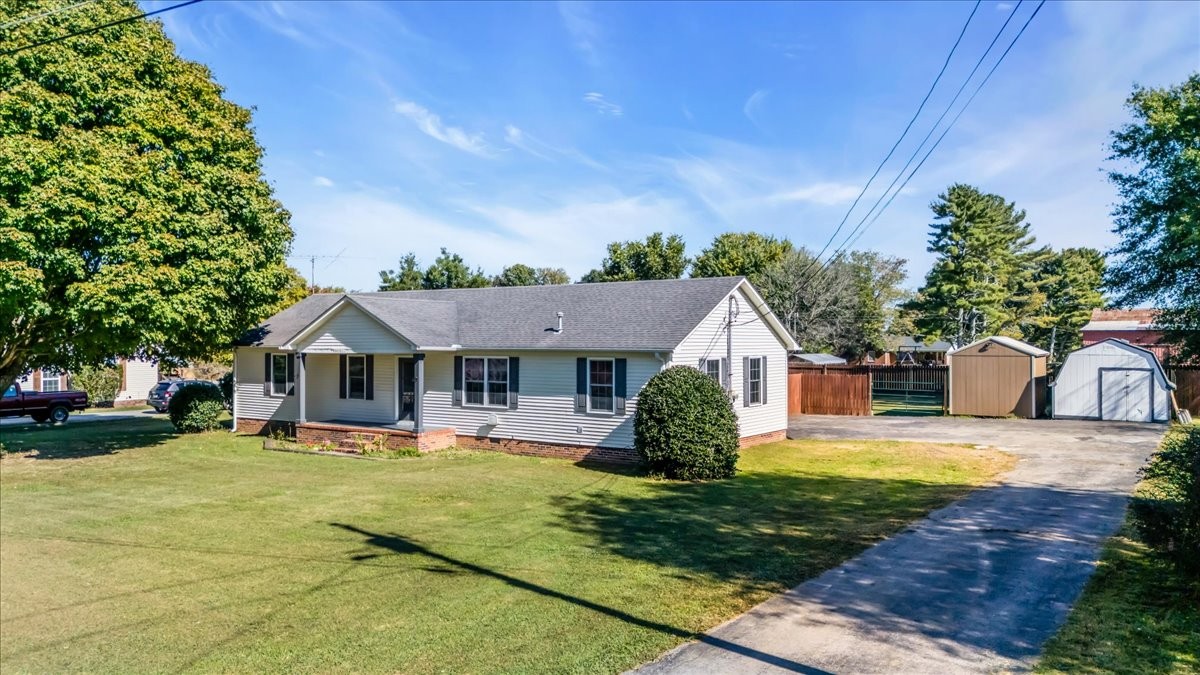 145 Hawkins Road Smithville, TN 37166 - Photo 28 of 45 a front view of a house with a yard