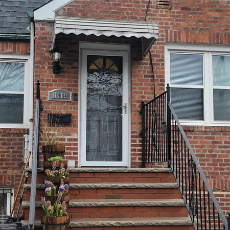 a front view of a house with glass windows