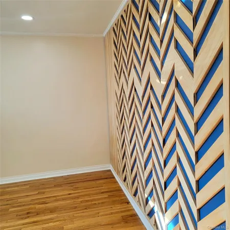 a bedroom with a bed and dresser