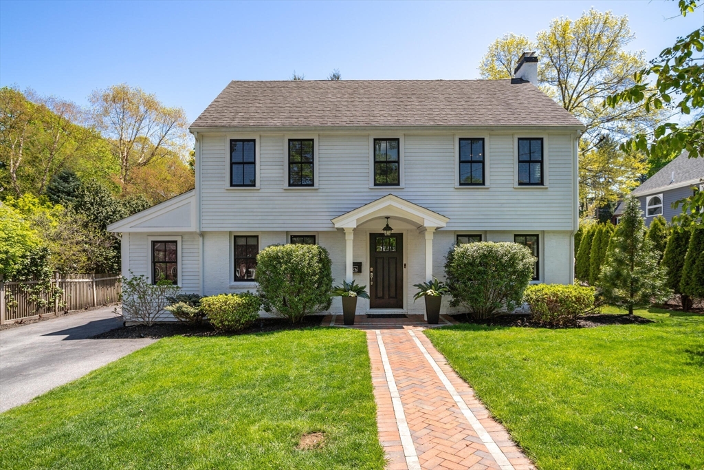 26 Stowell Road Winchester, MA 01890 - Photo 1 of 42 a front view of a house with a yard