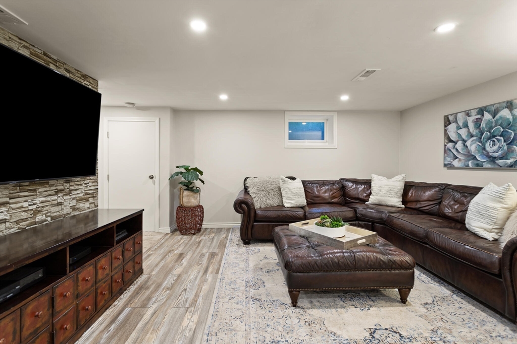 26 Stowell Road Winchester, MA 01890 - Photo 34 of 42 a living room with furniture and a flat screen tv