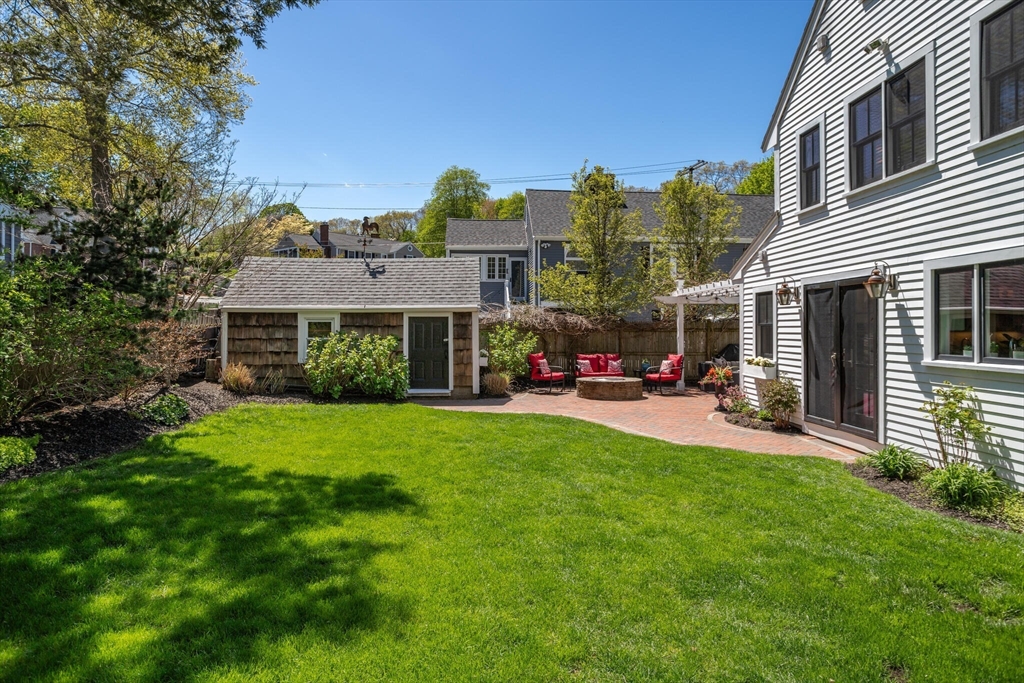 26 Stowell Road Winchester, MA 01890 - Photo 39 of 42 a view of a house with a yard porch and sitting area