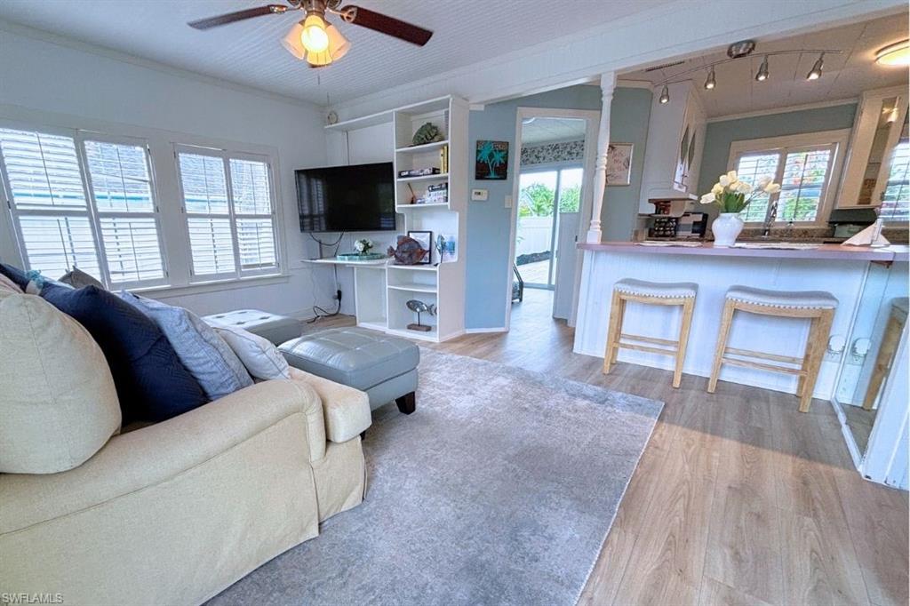 1012 Ridge Street Naples, FL 34103 - Photo 2 of 19 a living room with furniture and a flat screen tv