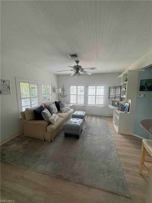 1012 Ridge Street Naples, FL 34103 - Photo 4 of 19 a living room with furniture and a wooden floor