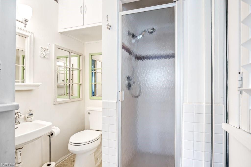 1012 Ridge Street Naples, FL 34103 - Photo 10 of 19 a bathroom with a sink toilet and shower