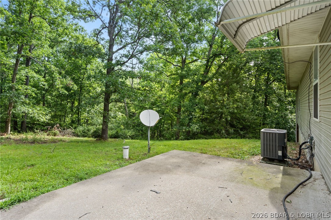 122 Hicks Drive Eldon, MO 65026 - Photo 42 of 51 Back yard and back porch