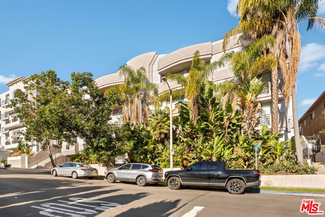 11535 Rochester Avenue, Unit 302 Los Angeles, CA 90025 - Photo 26 of 28 a car parked on the side of a street
