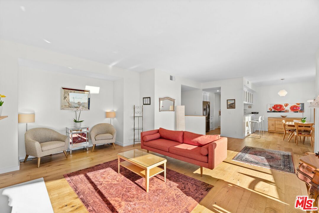 11535 Rochester Avenue, Unit 302 Los Angeles, CA 90025 - Photo 6 of 28 a living room with furniture a rug and a table