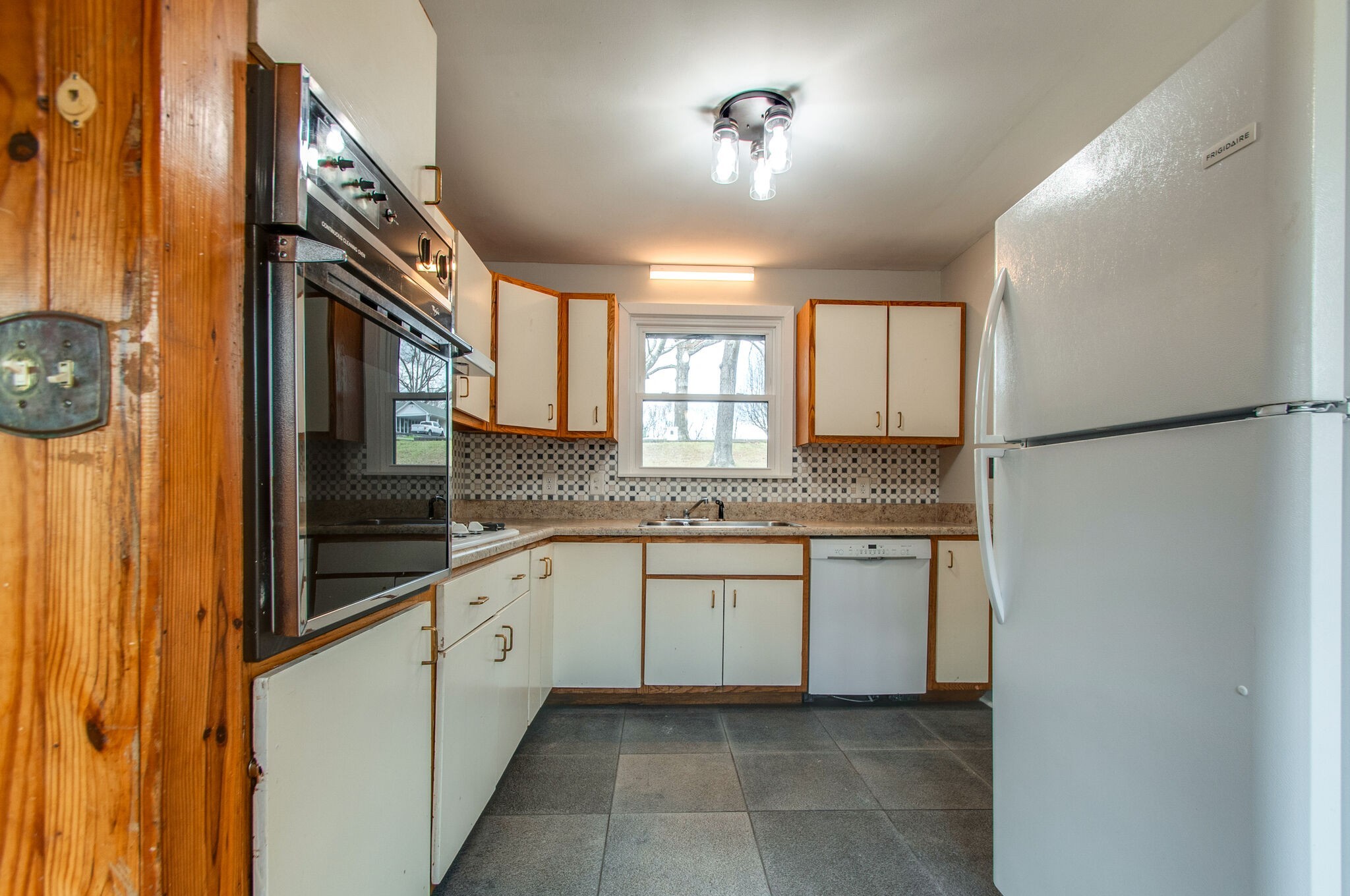 209 East Park Circle Dickson, TN 37055 - Photo 14 of 28 a bathroom with a granite countertop sink and a mirror
