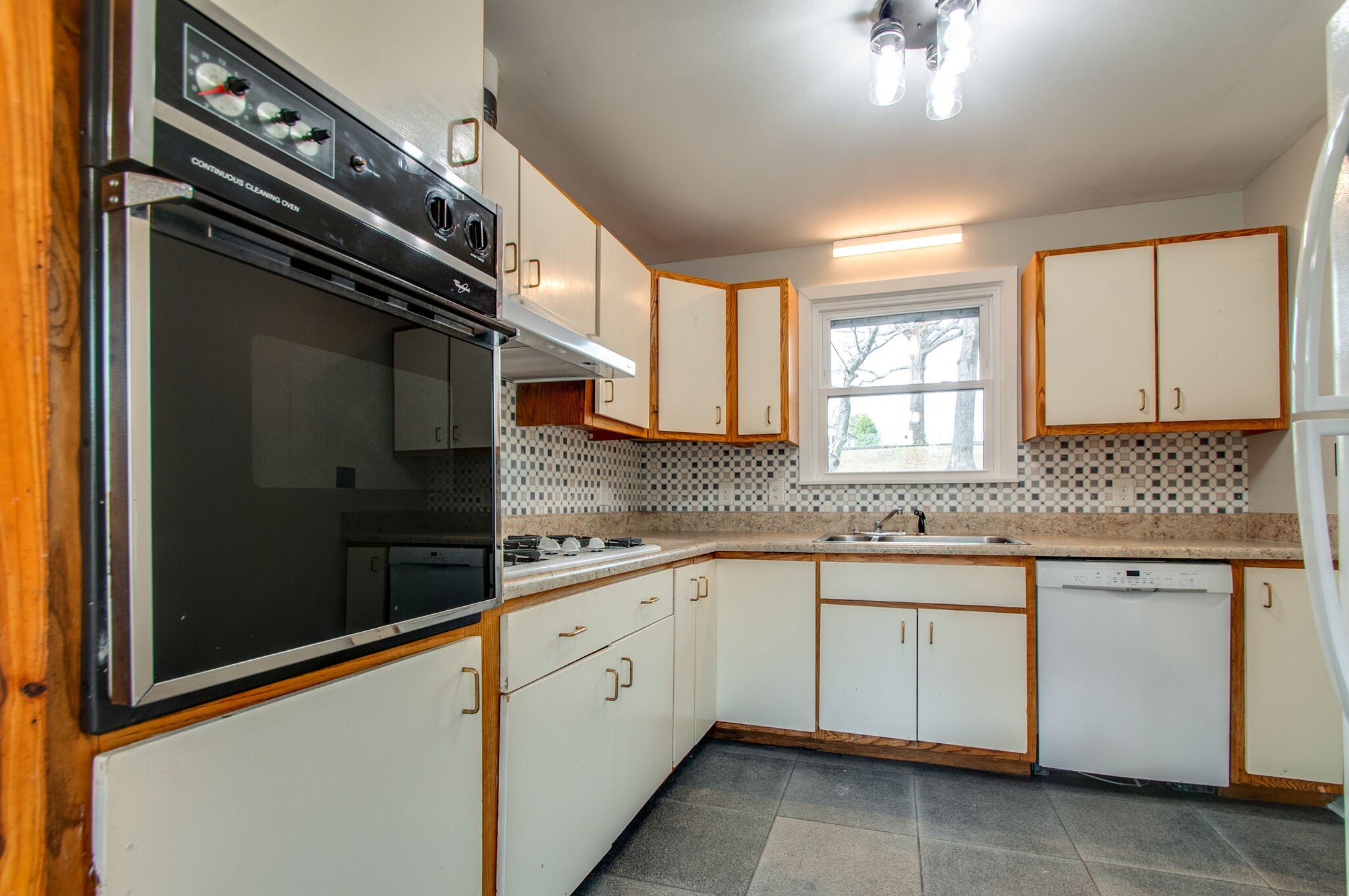 209 East Park Circle Dickson, TN 37055 - Photo 15 of 28 a kitchen with a sink and cabinets