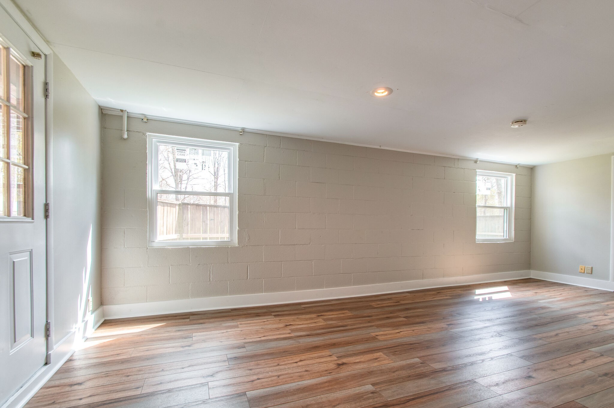 209 East Park Circle Dickson, TN 37055 - Photo 22 of 28 a view of an empty room with wooden floor and a window