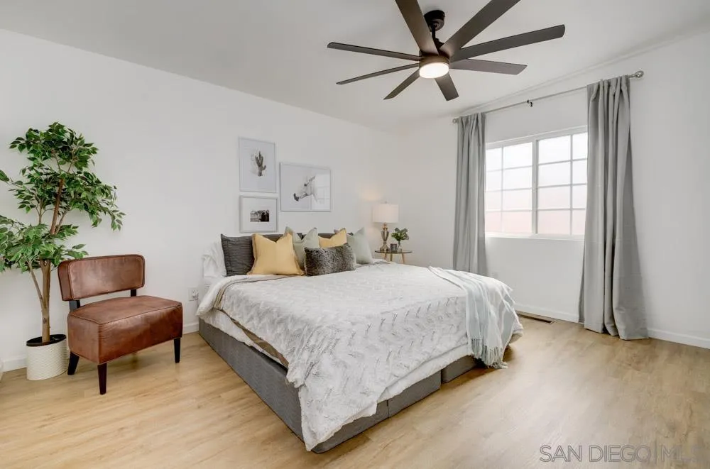 753 Farview Street El Cajon, CA 92021 - Photo 15 of 26 a spacious bedroom with a bed and a chair