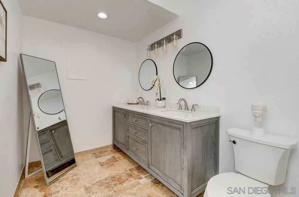 753 Farview Street El Cajon, CA 92021 - Photo 17 of 26 a bathroom with a toilet sink and a mirror