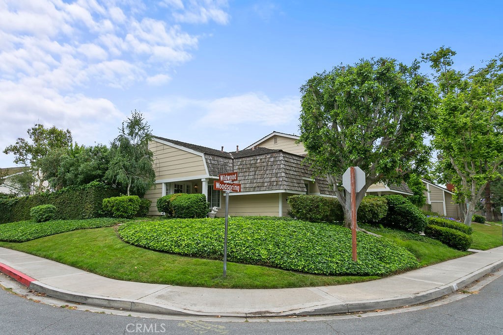 1 Woodspring, Unit 19 Irvine, CA 92604 - Photo 1 of 1 a front view of a house with a yard