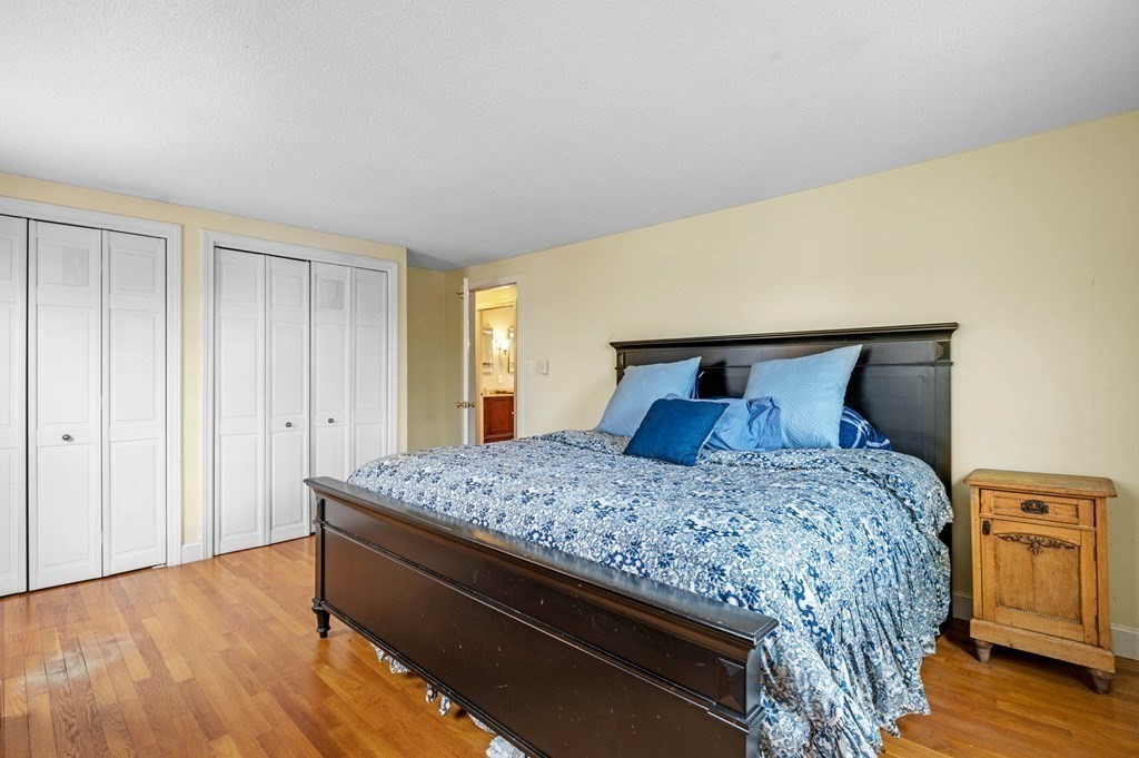 12 Pitman Road Marblehead, MA 01945 - Photo 13 of 28 a bedroom with a bed and wooden floor