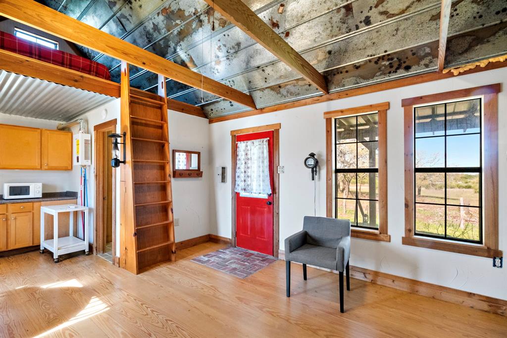 1012 Xxx County Road Bluff Dale, TX 76433 - Photo 12 of 19 a living room with furniture and a window