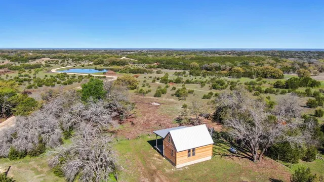 an aerial view of residential house with outdoor space
