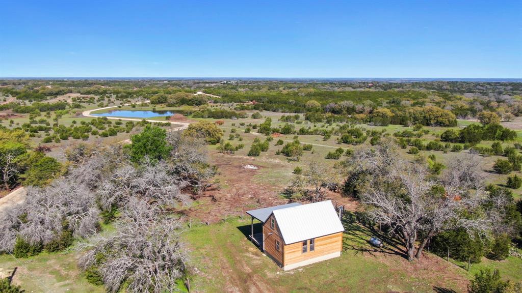1012 Xxx County Road Bluff Dale, TX 76433 - Photo 18 of 19 an aerial view of residential house with outdoor space