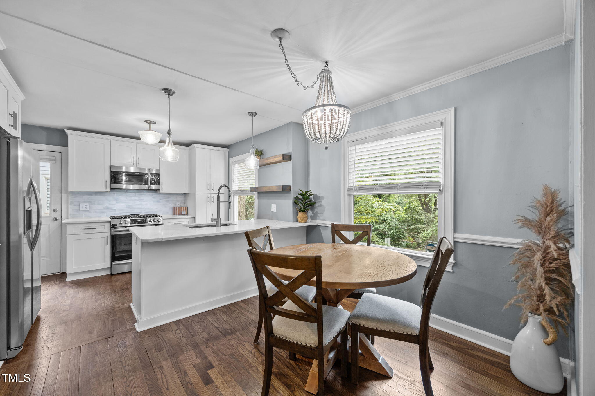 a view of a dining room with furniture window and wooden floor
