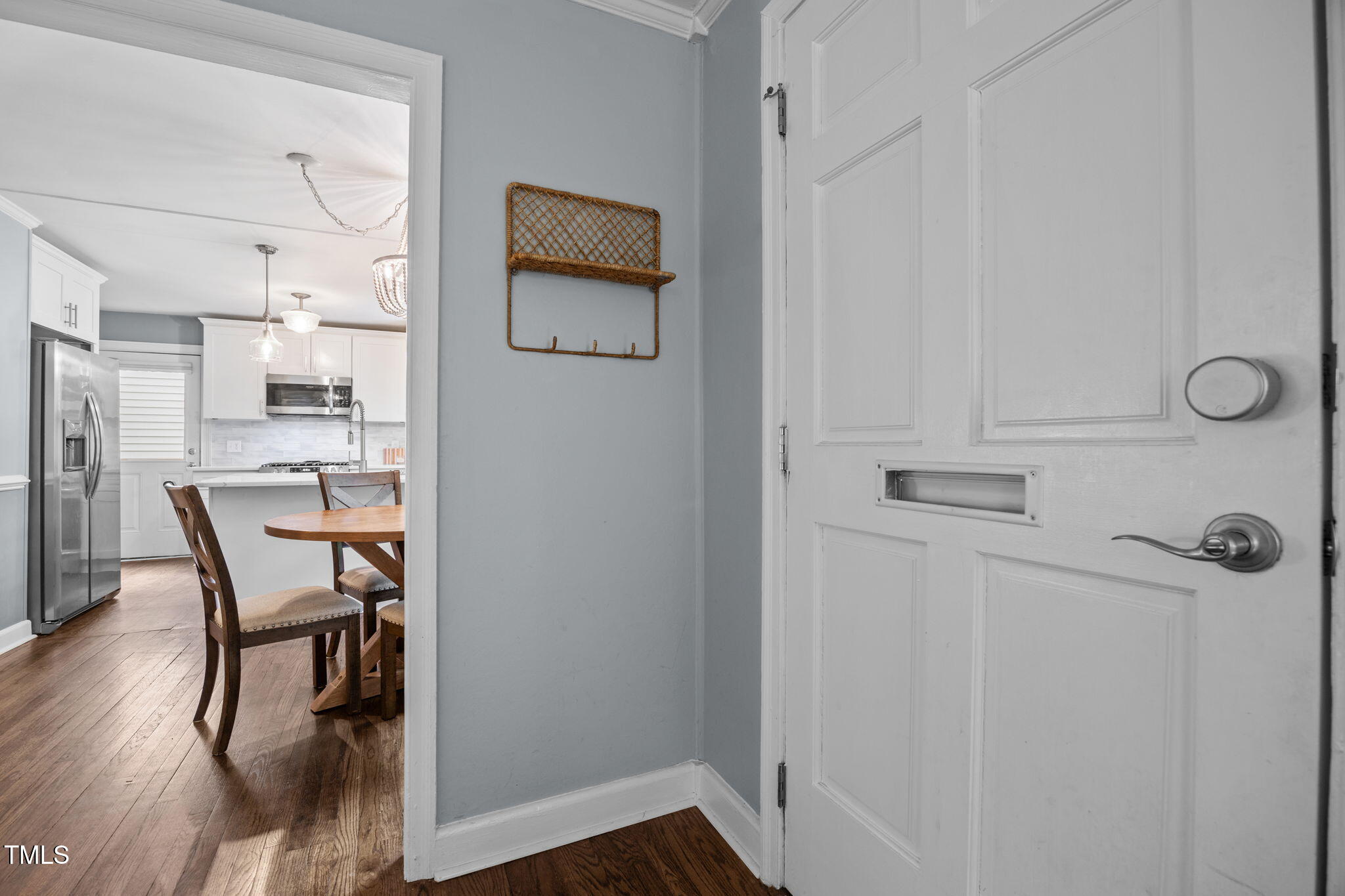2721 Cartier Drive Raleigh, NC 27608 - Photo 11 of 44 a view of a dining room with furniture and wooden floor