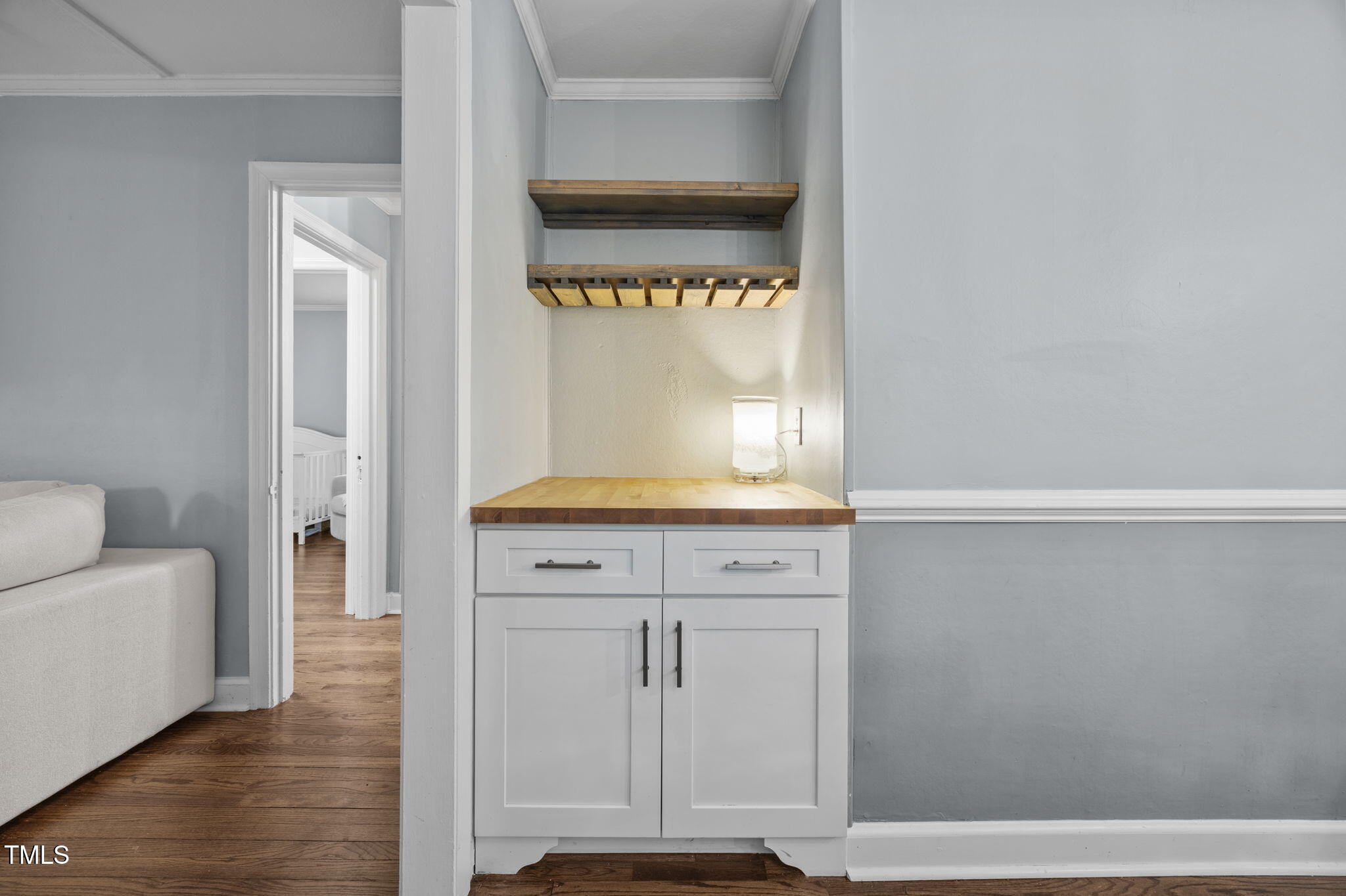 2721 Cartier Drive Raleigh, NC 27608 - Photo 12 of 44 a view of front door with wooden floor