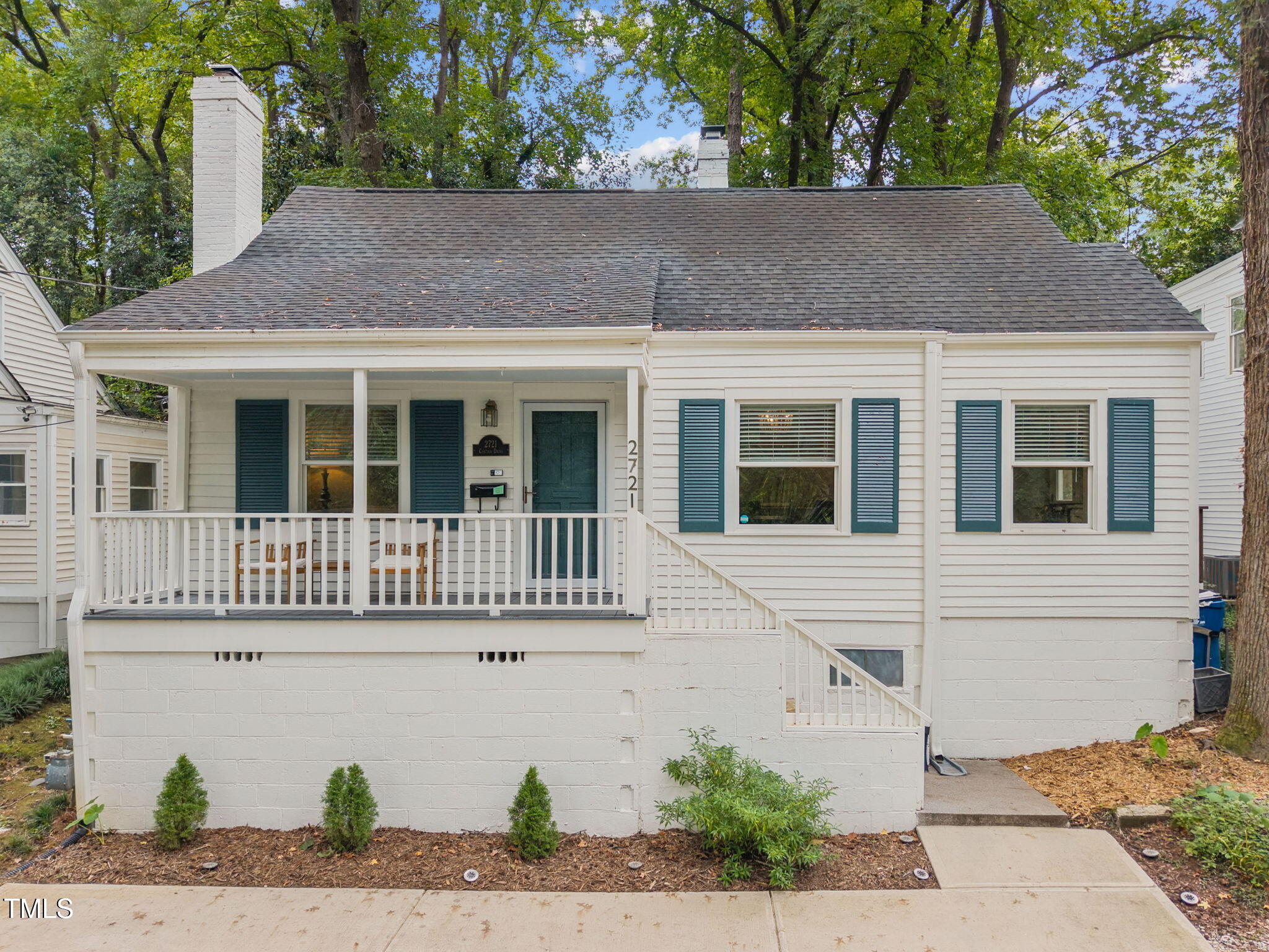 2721 Cartier Drive Raleigh, NC 27608 - Photo 2 of 44 a house view with a garden space