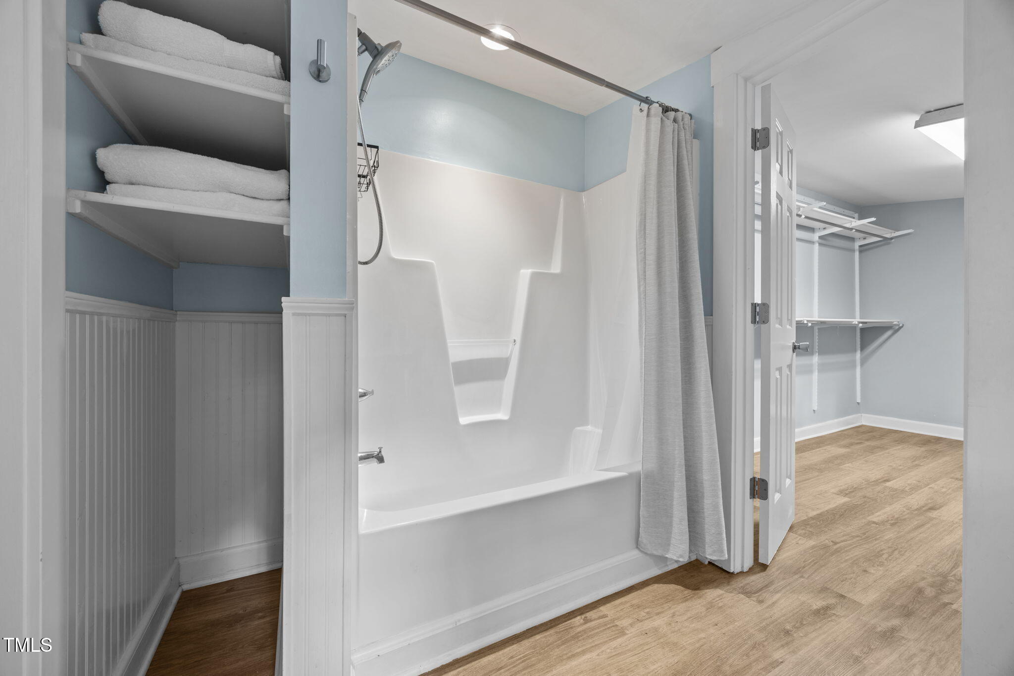 2721 Cartier Drive Raleigh, NC 27608 - Photo 23 of 44 a bathroom with a glass shower door and a sink