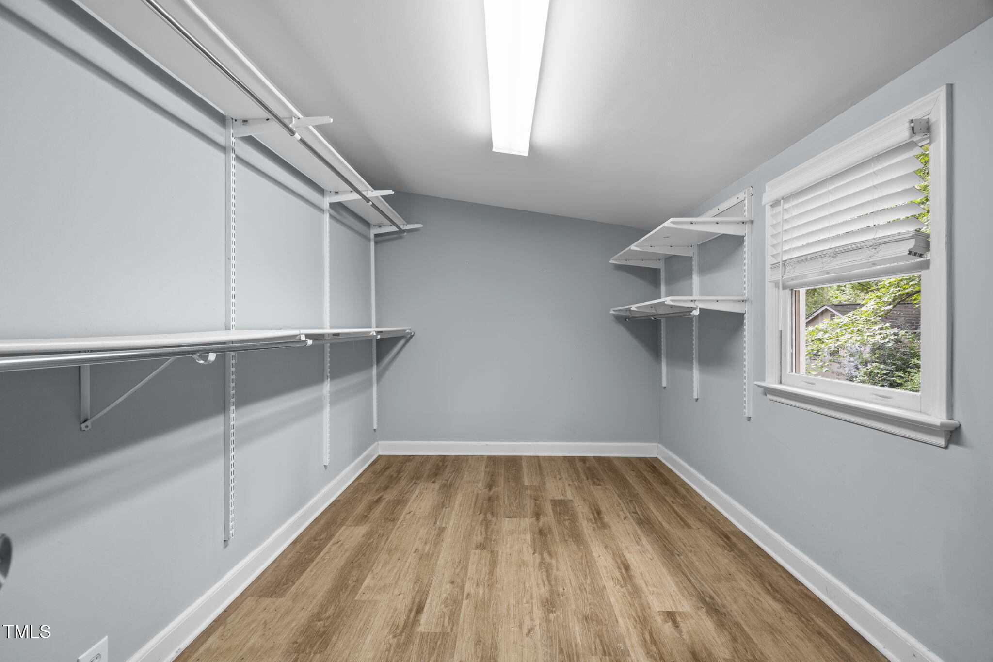 2721 Cartier Drive Raleigh, NC 27608 - Photo 25 of 44 a view of a room with racks on the wall