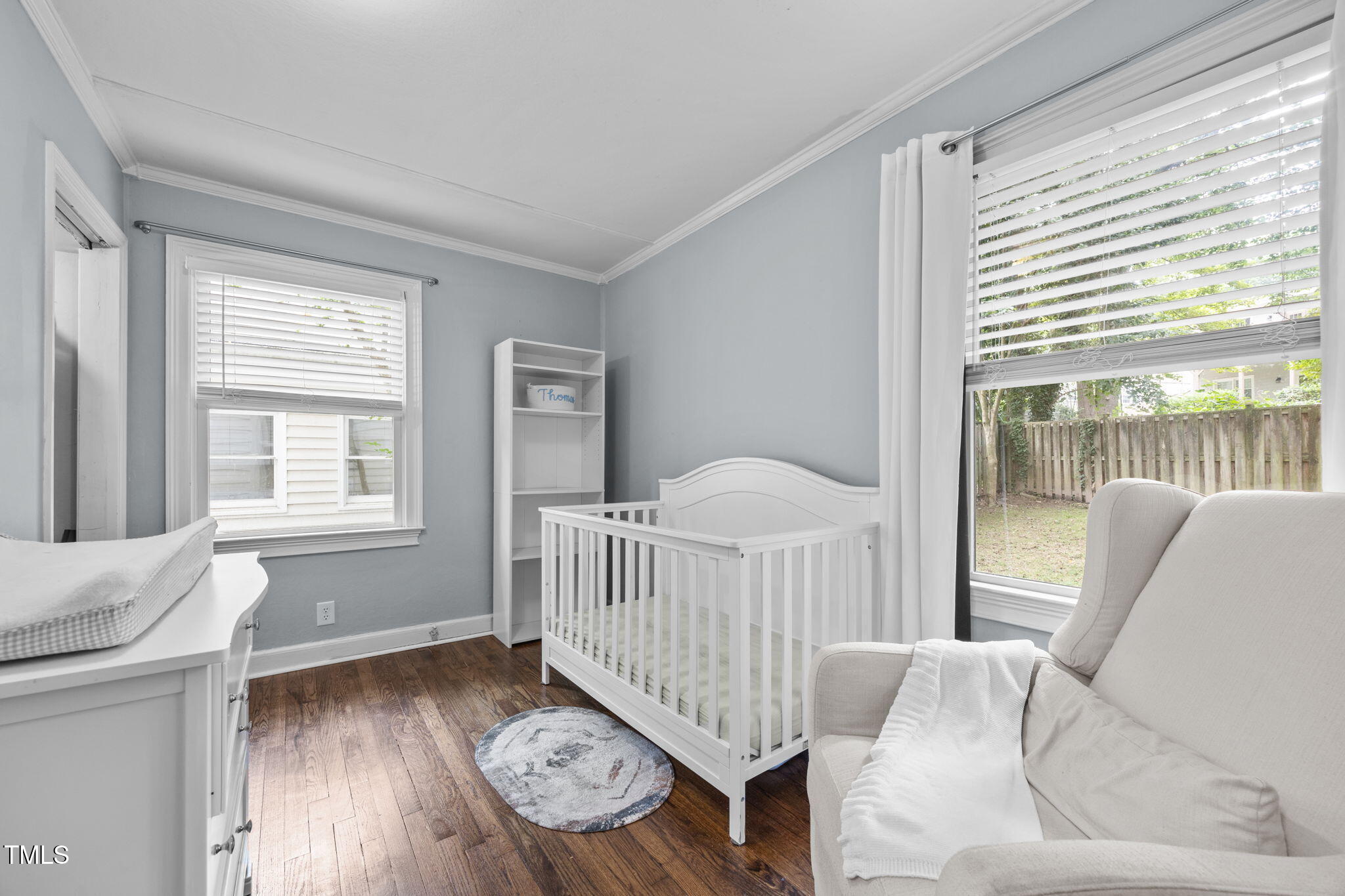 2721 Cartier Drive Raleigh, NC 27608 - Photo 27 of 44 a living room with furniture and a window