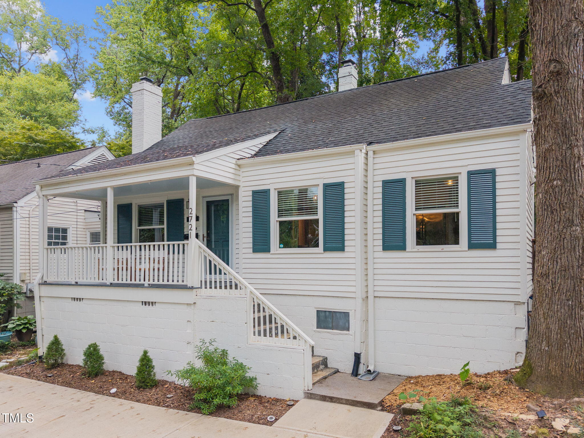 2721 Cartier Drive Raleigh, NC 27608 - Photo 3 of 44 a front view of a house with garden