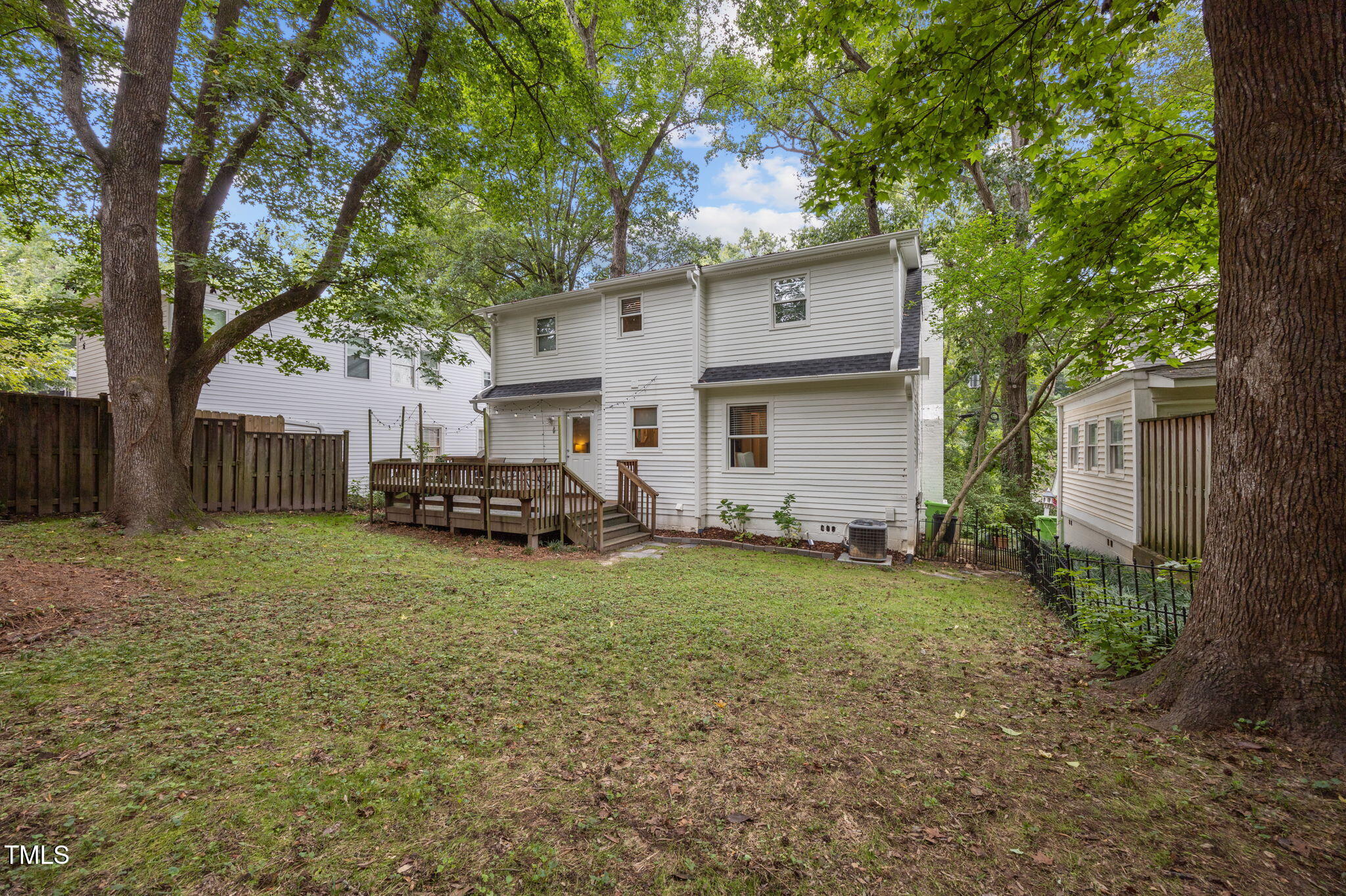 2721 Cartier Drive Raleigh, NC 27608 - Photo 33 of 44 a view of a house with backyard