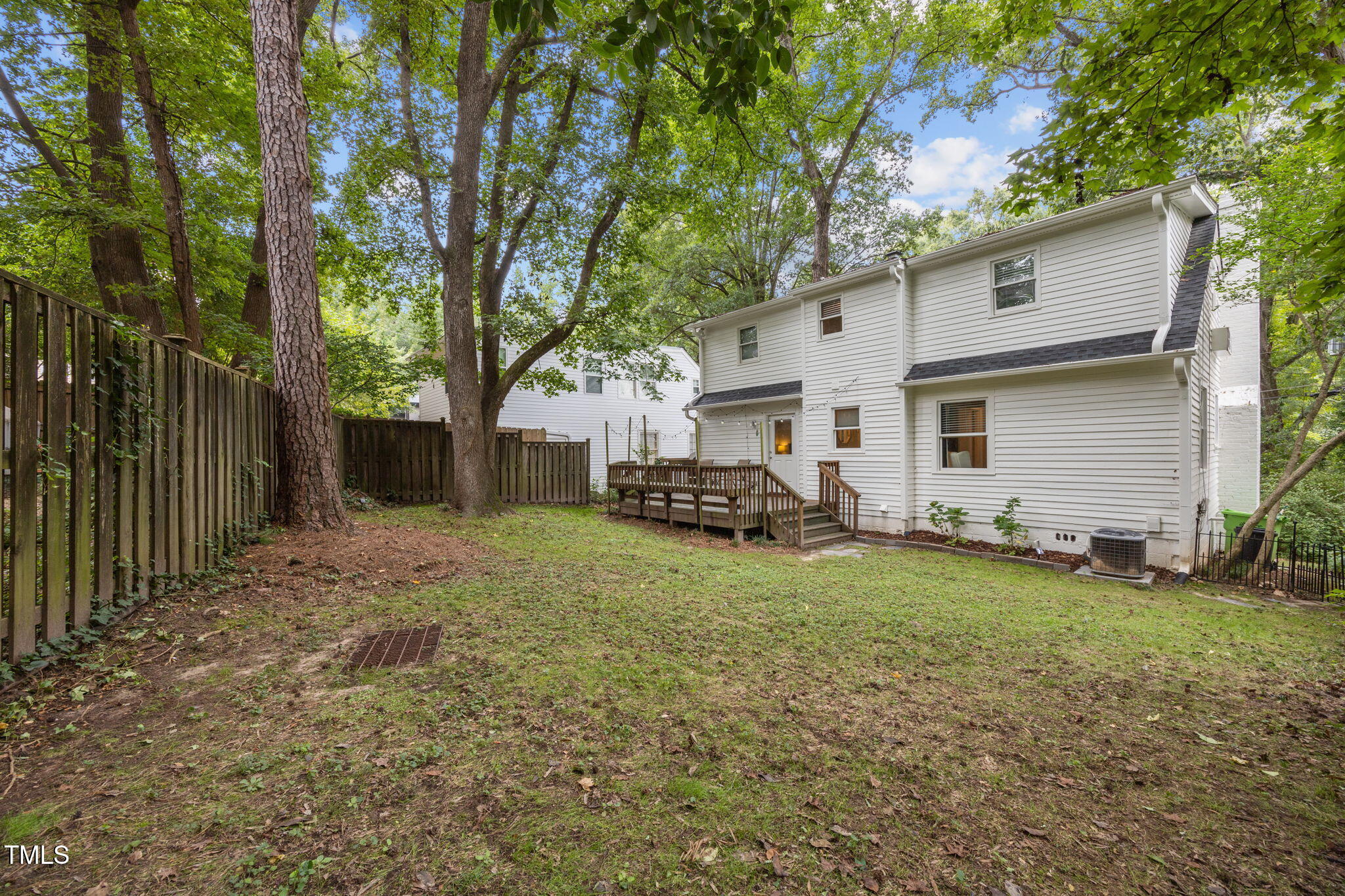 2721 Cartier Drive Raleigh, NC 27608 - Photo 34 of 44 a view of a house with backyard