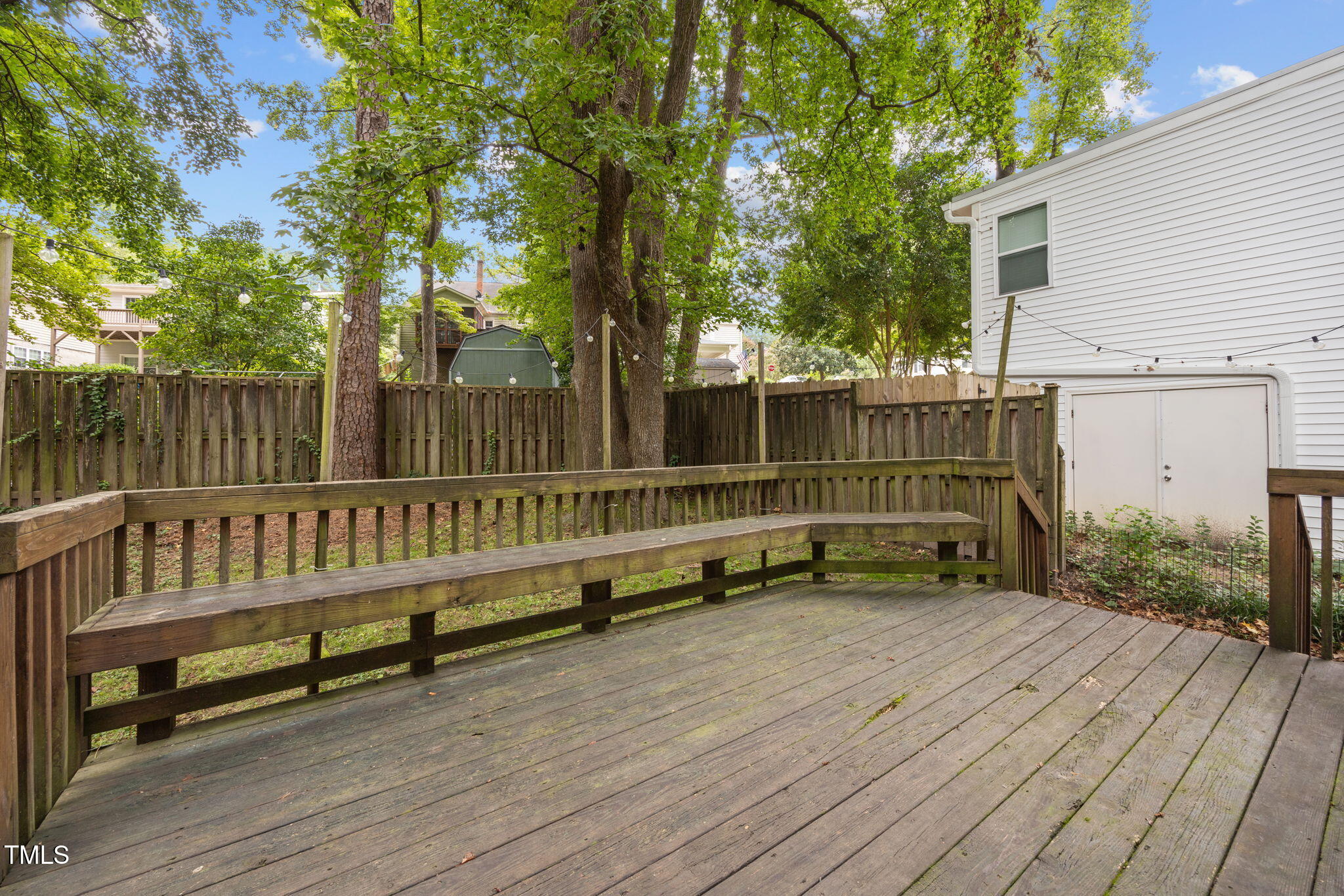 2721 Cartier Drive Raleigh, NC 27608 - Photo 36 of 44 a view of wooden deck with a bench