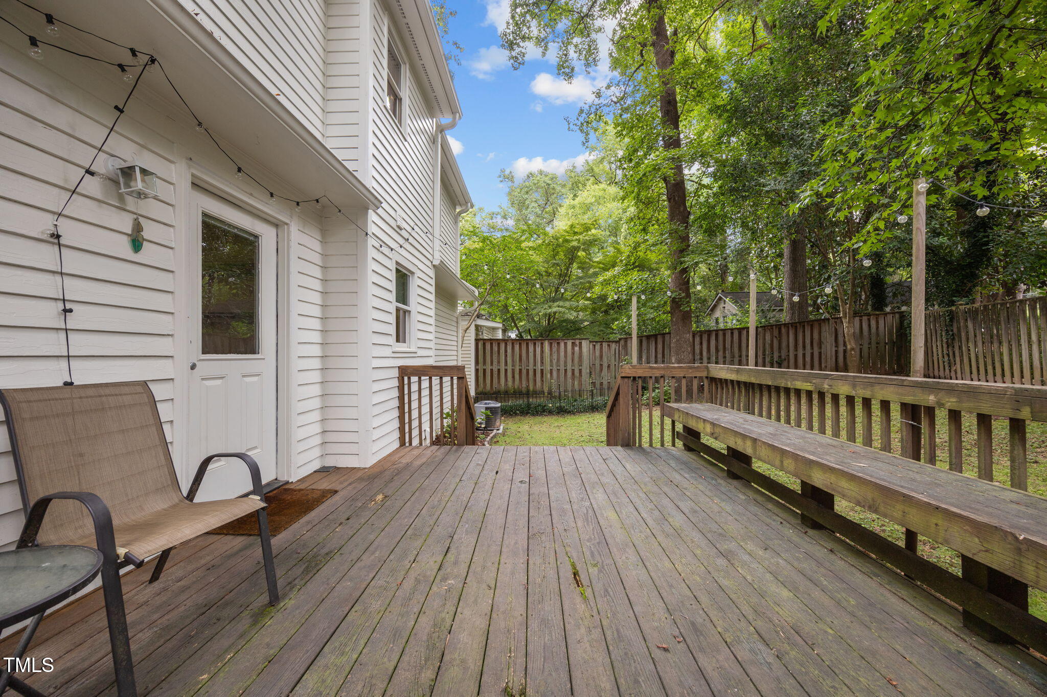 2721 Cartier Drive Raleigh, NC 27608 - Photo 37 of 44 a view of balcony with wooden floor and outdoor seating
