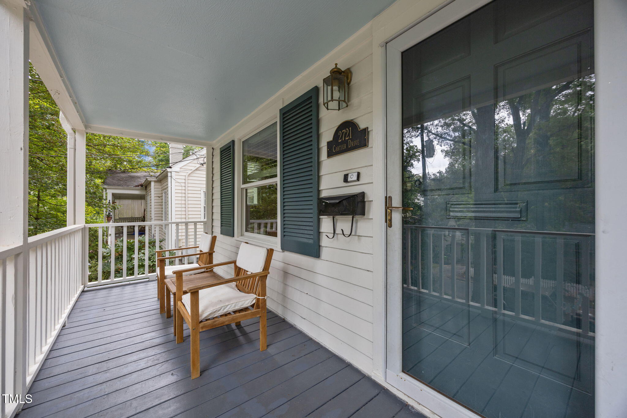 2721 Cartier Drive Raleigh, NC 27608 - Photo 38 of 44 a balcony with furniture and wooden floor