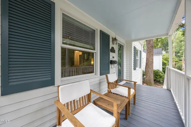 a view of a chair and table in the balcony