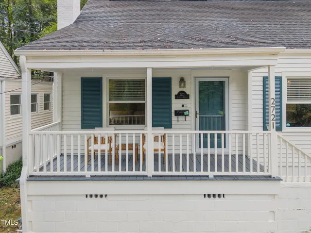 a view of a house with wooden fence