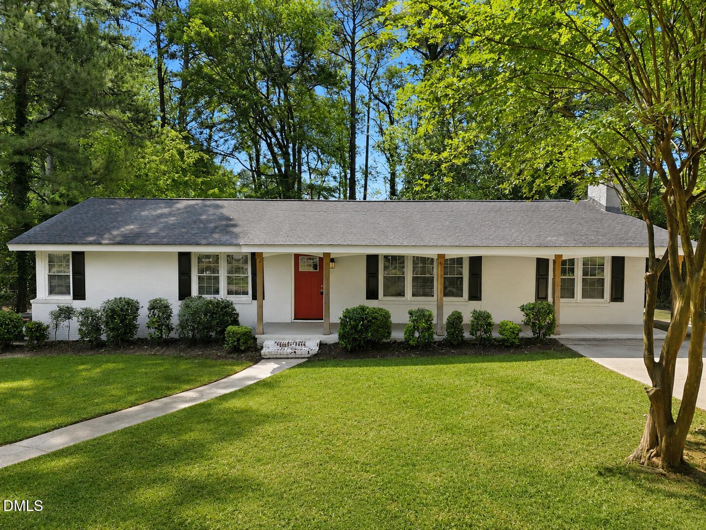 2950 Glenridge Drive Raleigh, NC 27604 - Photo 1 of 53 a view of a house with a yard and sitting area