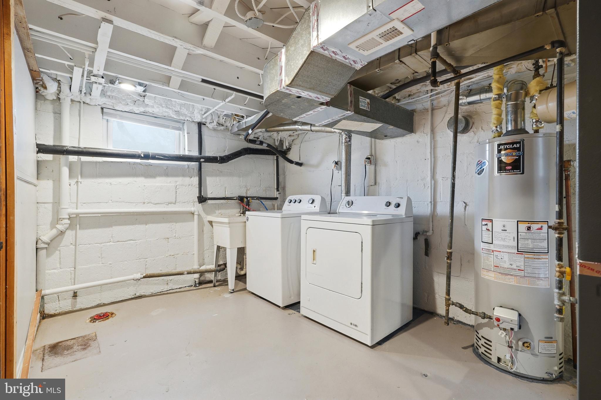 10015 Reddick Drive Silver Spring, MD 20901 - Photo 39 of 41 a utility room with cabinets dryer and washer