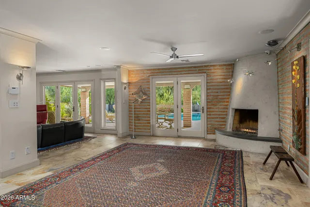 a living room with furniture windows and a fireplace