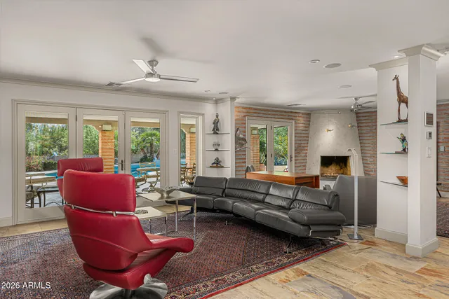 a living room with furniture and a chair