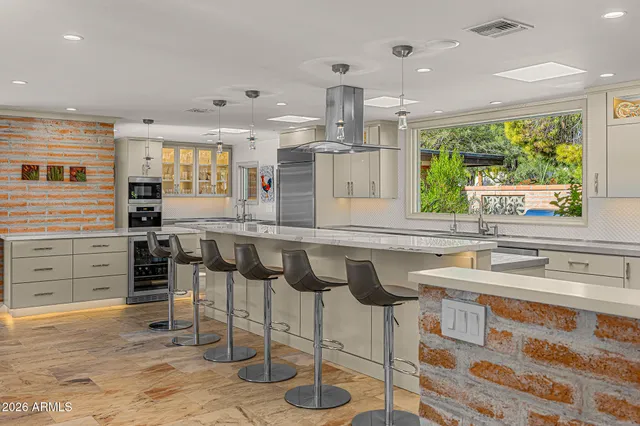 a kitchen with a granite countertop sink and a granite counter top