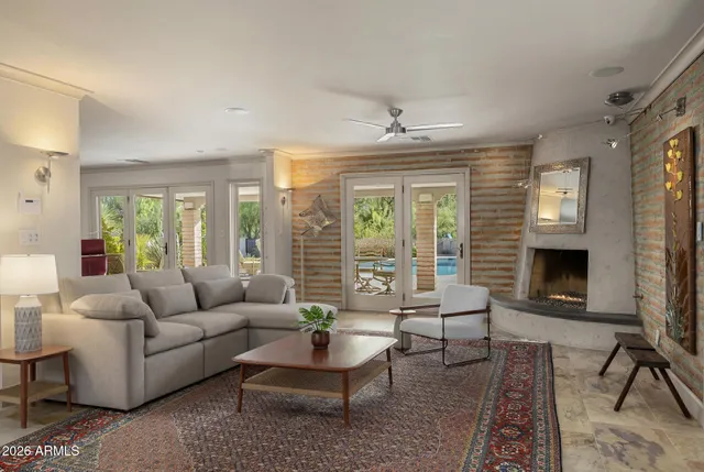 a living room with furniture and a fireplace