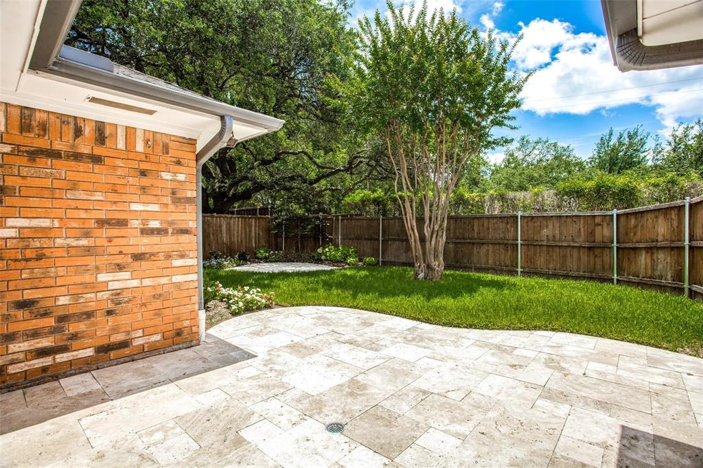 6926 Northwood Road Dallas, TX 75225 - Photo 28 of 29 a view of a backyard with wooden fence