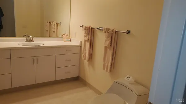 a bathroom with a sink and mirror