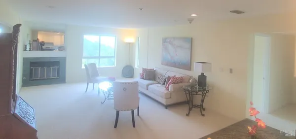 a living room with furniture and a table