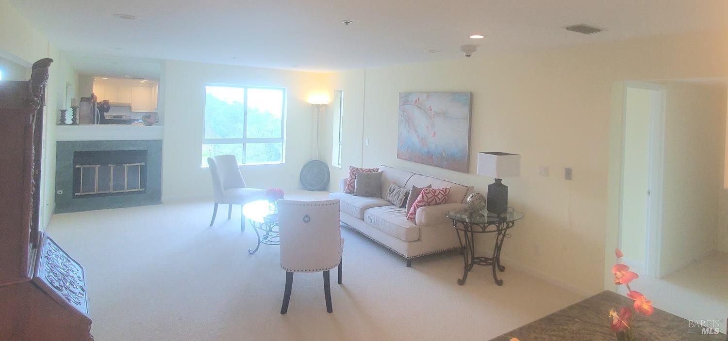 100 Thorndale Drive, Unit 327 San Rafael, CA 94903 - Photo 3 of 13 a living room with furniture and a table