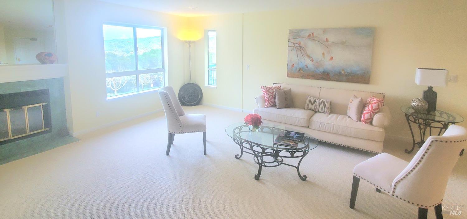 100 Thorndale Drive, Unit 327 San Rafael, CA 94903 - Photo 4 of 13 a living room with furniture and a large window